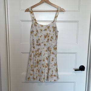Cute summer or spring dress with yellow and purple flowers. Lined, zipper.